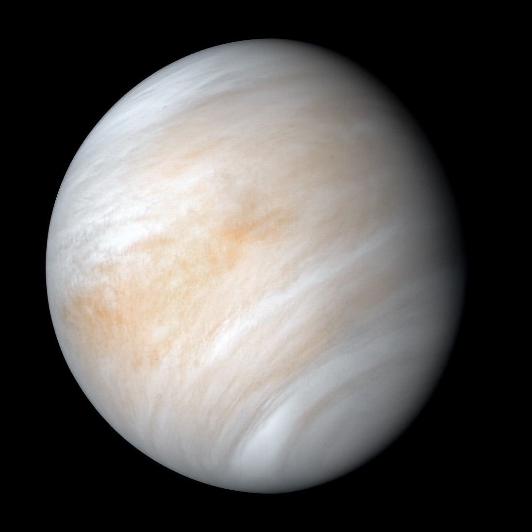 Venus surrounded by black space, with pale white and tan cloud bands in a processed Mariner 10 composite.